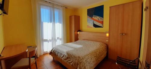 Postelja oz. postelje v sobi nastanitve Hotel Chiara