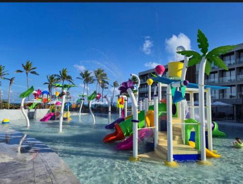 a water park with a water slide in the water at Porto 2 live in Porto De Galinhas
