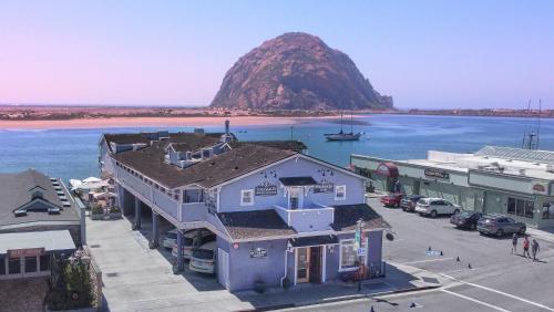 an aerial view of a town with a mountain in the water at Anderson Inn in Morro Bay