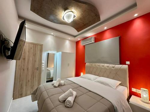 En eller flere senge i et værelse på Aggelos Rooms 2
