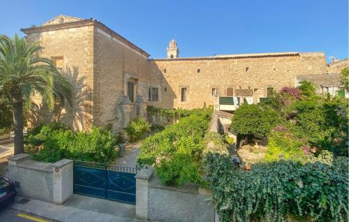 an external view of a building with trees and plants at Convent Holiday Home in Petra