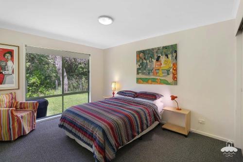 a bedroom with a bed and a window at The Ash, Sandy Point Stay 3 Pay 2 Winter Special in Sandy Point