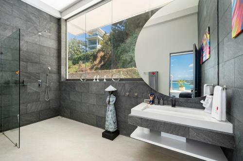 a bathroom with a large sink and a shower at STK Villa Samui Paradise Awaits in Nathon Bay