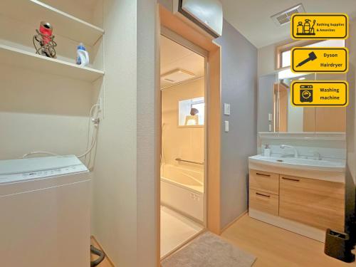 a bathroom with a sink and a mirror at ヴィラ山間堂Panorama Villa BBQ Bonfire Fuji view Annovillas Sankando in Fujikawaguchiko