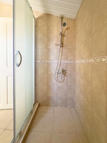a bathroom with a shower with a glass door at Paradise Town Villa Abel in Belek