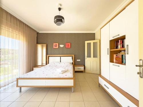a bedroom with a bed in a room at Paradise Town Villa Abel in Belek