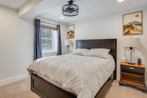 a bedroom with a large bed and a window at Beach Access & Fire Pit! Potomac River Retreat in Montross
