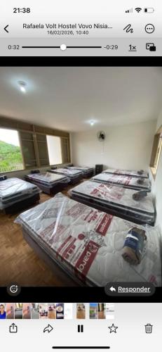 a picture of a room with several beds in it at MGerais Hostel e Empório in Visconde do Rio Branco