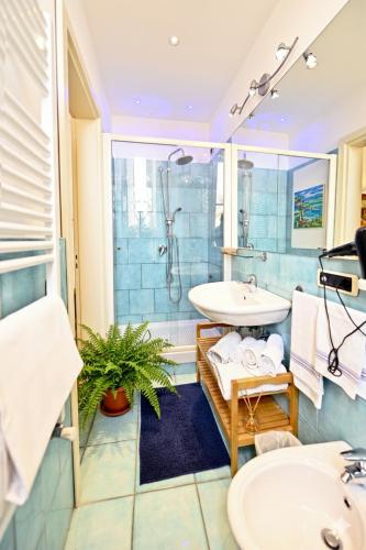 a bathroom with a sink and a shower at Residenza Sole Amalfi in Amalfi