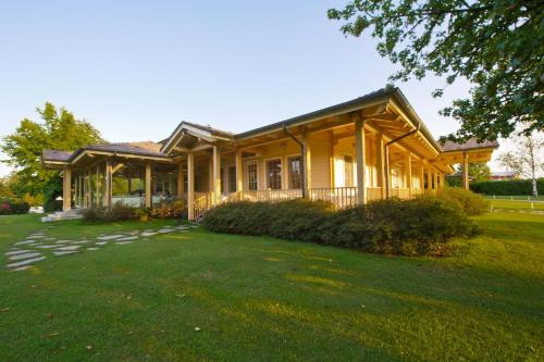 a house with a large yard in front of it at Golf Hotel Cavaglià in Cavaglià