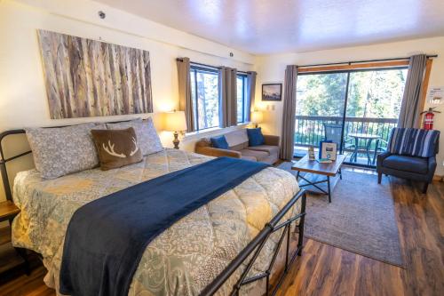 a bedroom with a bed and a living room at Inside Yosemite Park-Cozy Corner Unit-Sleeps 2 in Yosemite West