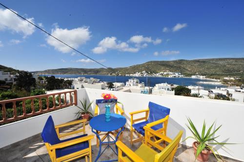 a balcony with chairs and a table with a view at Pension Sofia Amorgos-Katapola in Katapola