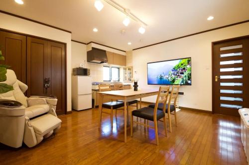 a kitchen and dining room with a table and chairs at Forest Inokashira in Mitaka