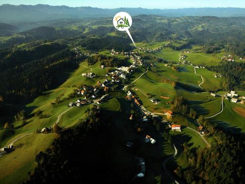 a hot air balloon flying over a golf course at Lookout Resort in the green heart of Slovenia in Rovte
