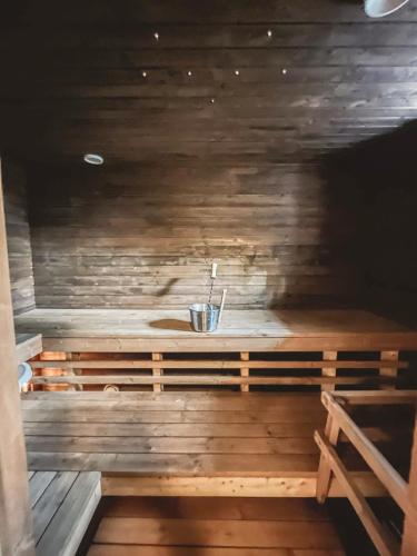 a sauna with a bench in a wooden room at Beautiful Home in Sipoo in Söderkulla