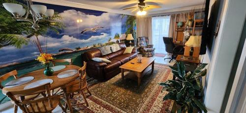 a living room with a couch and a table at Unique 2 Bedroom / 2 Bath Condo in Myrtle Beach in Myrtle Beach