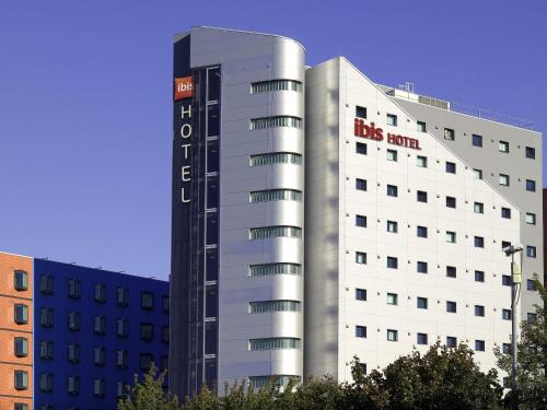 a large white building with a big room sign on it at ibis Leeds Centre Marlborough Street in Leeds