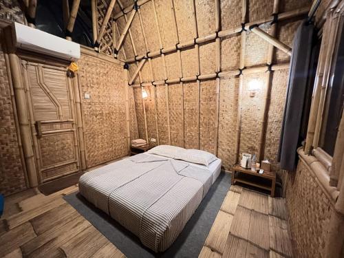 a bedroom with a bed in a room at C Family Hotel in Citeureup 1