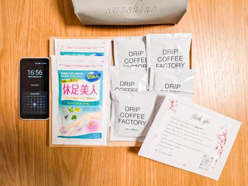 a table with some food and a cell phone at New! Ten people Shin Ookubo 6minPocket WIFI in Tokyo
