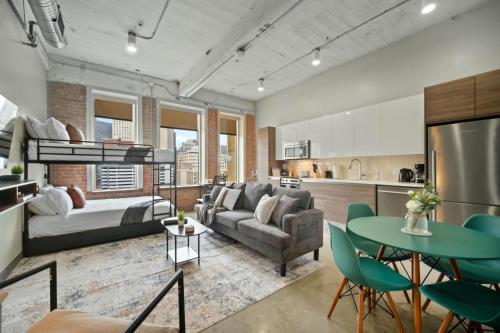 a living room with a couch and a table at Beautiful Downtown Apartment with Pool, Laundry, Parking in Dallas