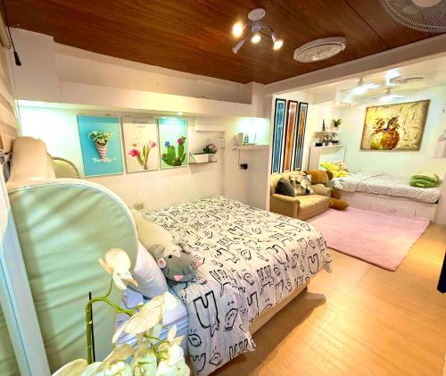a bedroom with a bed and a living room at The White Haven In Clark ENTIRE HOUSE in Angeles
