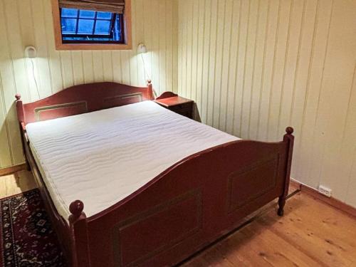 a bedroom with a large bed in a room at 5 person holiday home in Røros in Røros