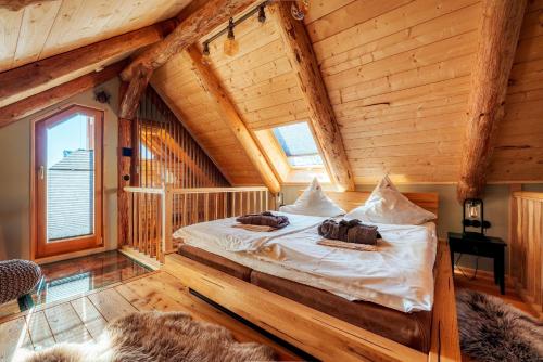 a bedroom with a bed in a log cabin at Blockhaus PanHütte in Braunlage