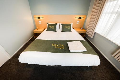 a hotel room with a large bed in a room at Rayya Suites, Paihia in Paihia