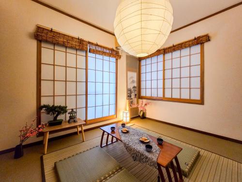 a living room with a table and some windows at New! Ten people Shin Ookubo 6minPocket WIFI in Tokyo