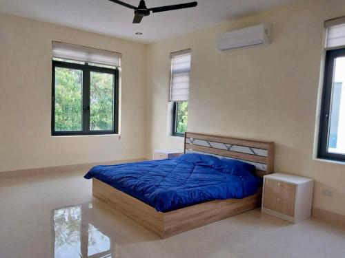 Llit o llits en una habitació de Suansavath Residence