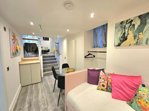 a living room with a couch and a table at Stylish & Central Design Apartment- 3 Beds in Edinburgh