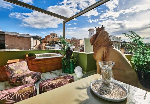 a balcony with a glass vase on a table at Fairytale Athens - Luxury Suites in Athens