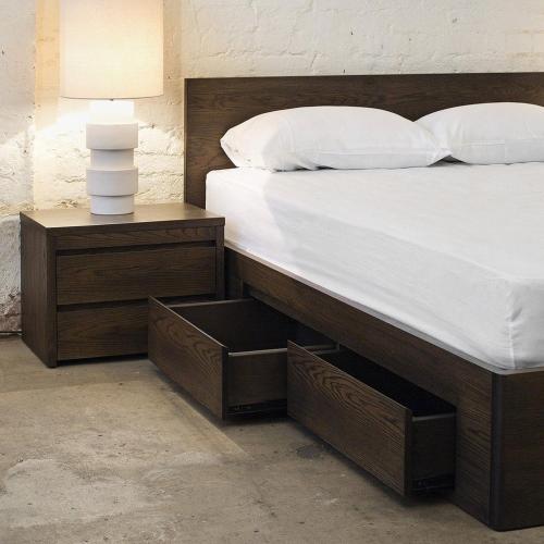 a bedroom with a bed with a nightstand and a white bed sidx sidx sidx at Sparsh Inn Hotel & Geust House in Gorakhpur