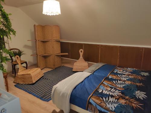 a bedroom with a bed and a potted plant at Maison de campagne in Le Puy