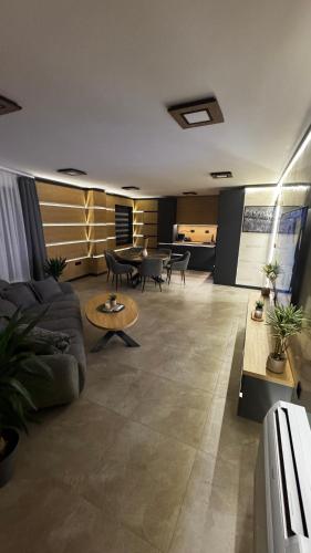 a living room with a couch and a table at Luxury Apartments TRED in Pleven