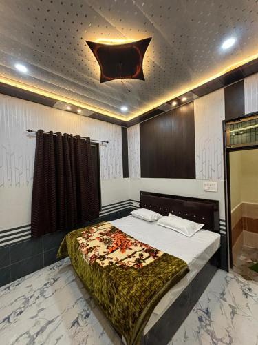 a bedroom with a bed in a room at Seeta Palace in Ayodhya