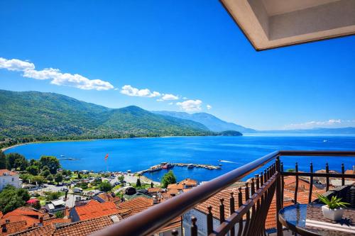a view of a lake from a balcony at Villa Mesokastro in Ohrid