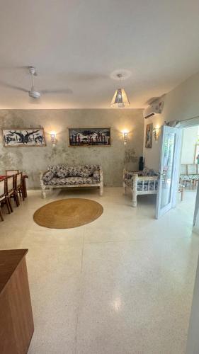 a living room with a couch and a table at Villa Rebecca 1 at Paparemo Village in Watamu