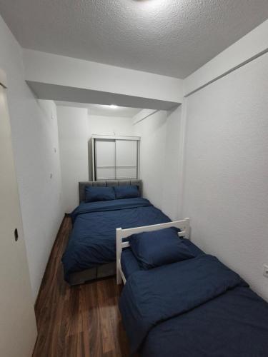 Llit o llits en una habitació de Eloi Apartment