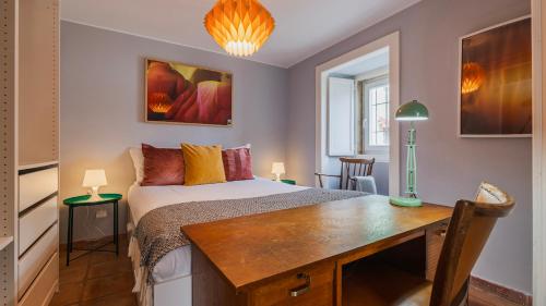 a bedroom with a bed and a desk in it at Artsy Sintra I by LovelyStay in Sintra