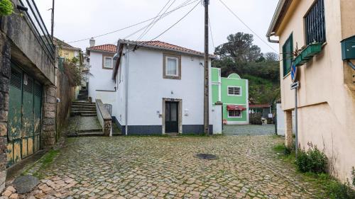 a cobblestone street in a town with buildings at Artsy Sintra I by LovelyStay in Sintra