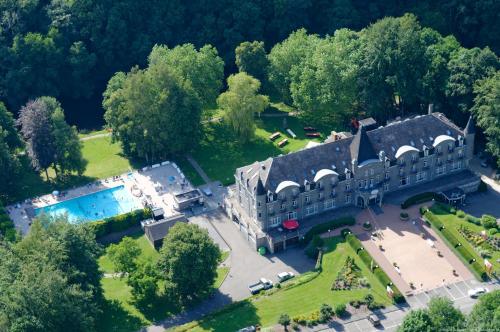 an aerial view of a mansion with a pool at Floreal La Roche-en-Ardenne in La-Roche-en-Ardenne