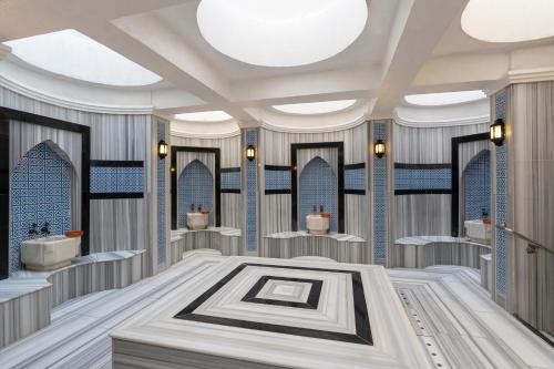 a rendering of a bathroom with sinks and mirrors at Limak Atlantis Deluxe Hotel Belek in Belek