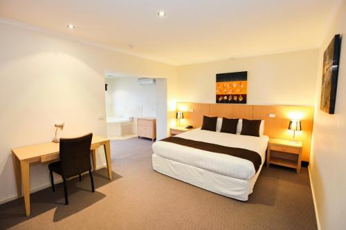 Ένα ή περισσότερα κρεβάτια σε δωμάτιο στο Mercure Hotel Mildura