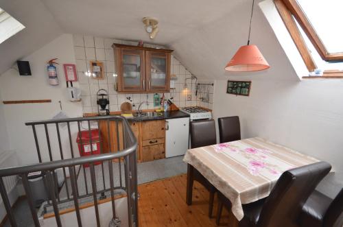 a kitchen with a table and a dining room at Selfcatering Apartment in Currahy Bridge