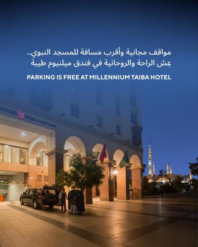a building with a sign that reads parking is free at williman plaza at Millennium Taiba Hotel in Medina