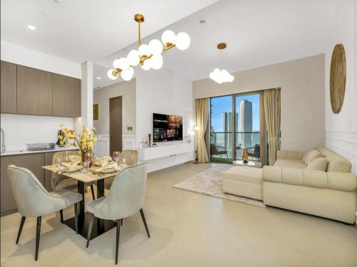 a kitchen and living room with a table and chairs at Luxurious Private Room in Burj Vista with Burj Khalifa View in Dubai