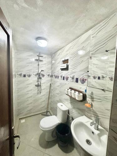 a bathroom with a toilet and a sink at Binic guest house in Taghazout