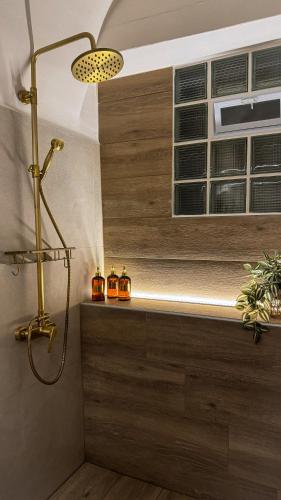 a bathroom with a shower and a window at Sadarmis Houses in Leonidio