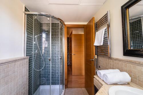 a bathroom with a shower and a sink at GAV Ciudad in Ronda